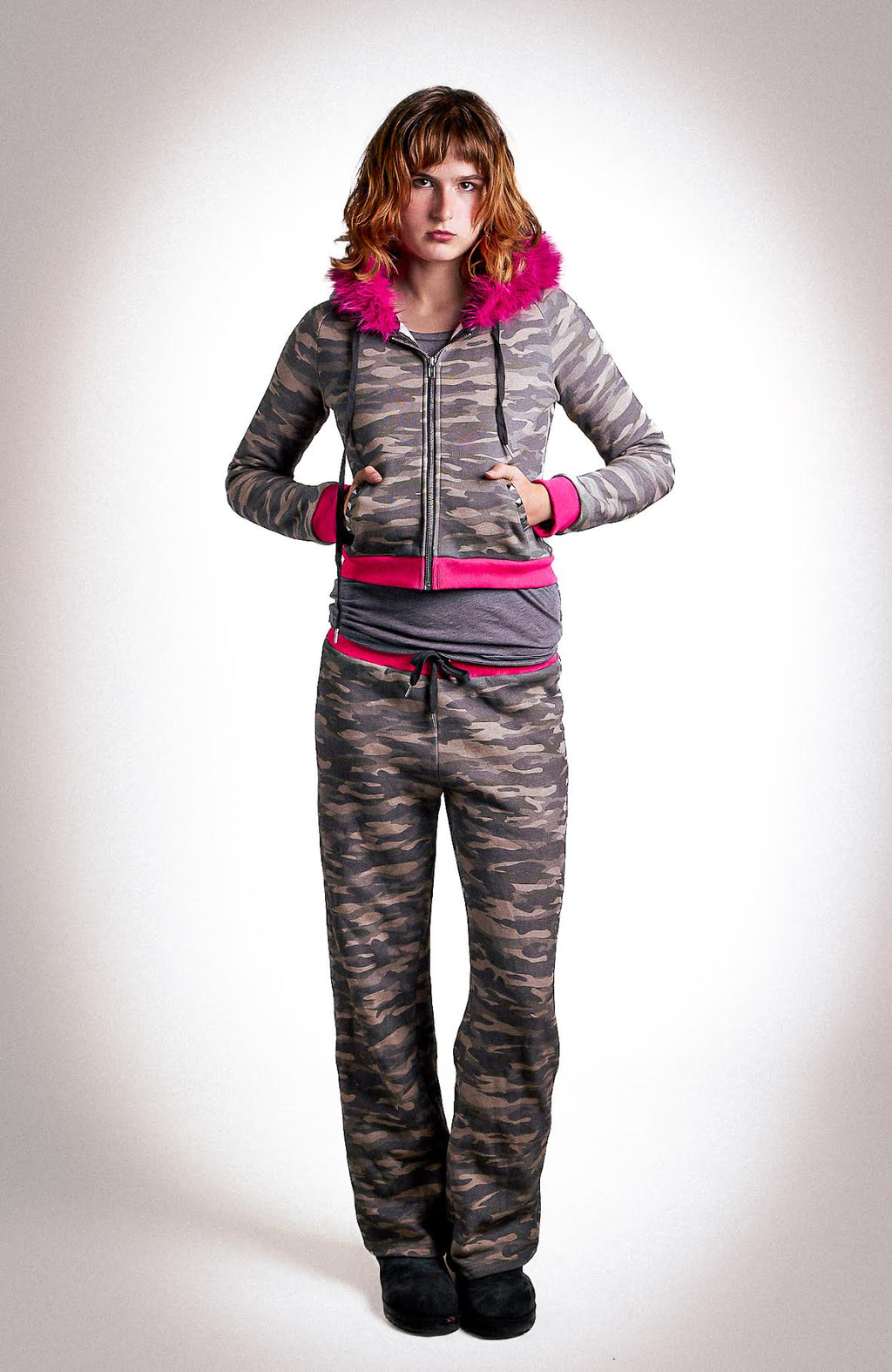 Low-waisted camo and hot pink sweatpants